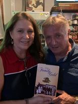 A couple holding The Family Gold