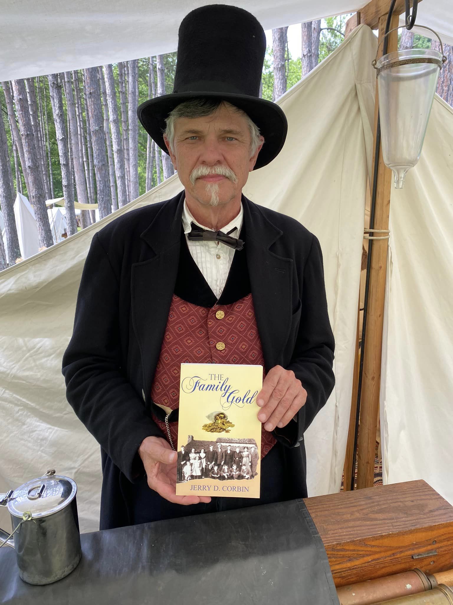 Reenactor in period dress with The Family Gold