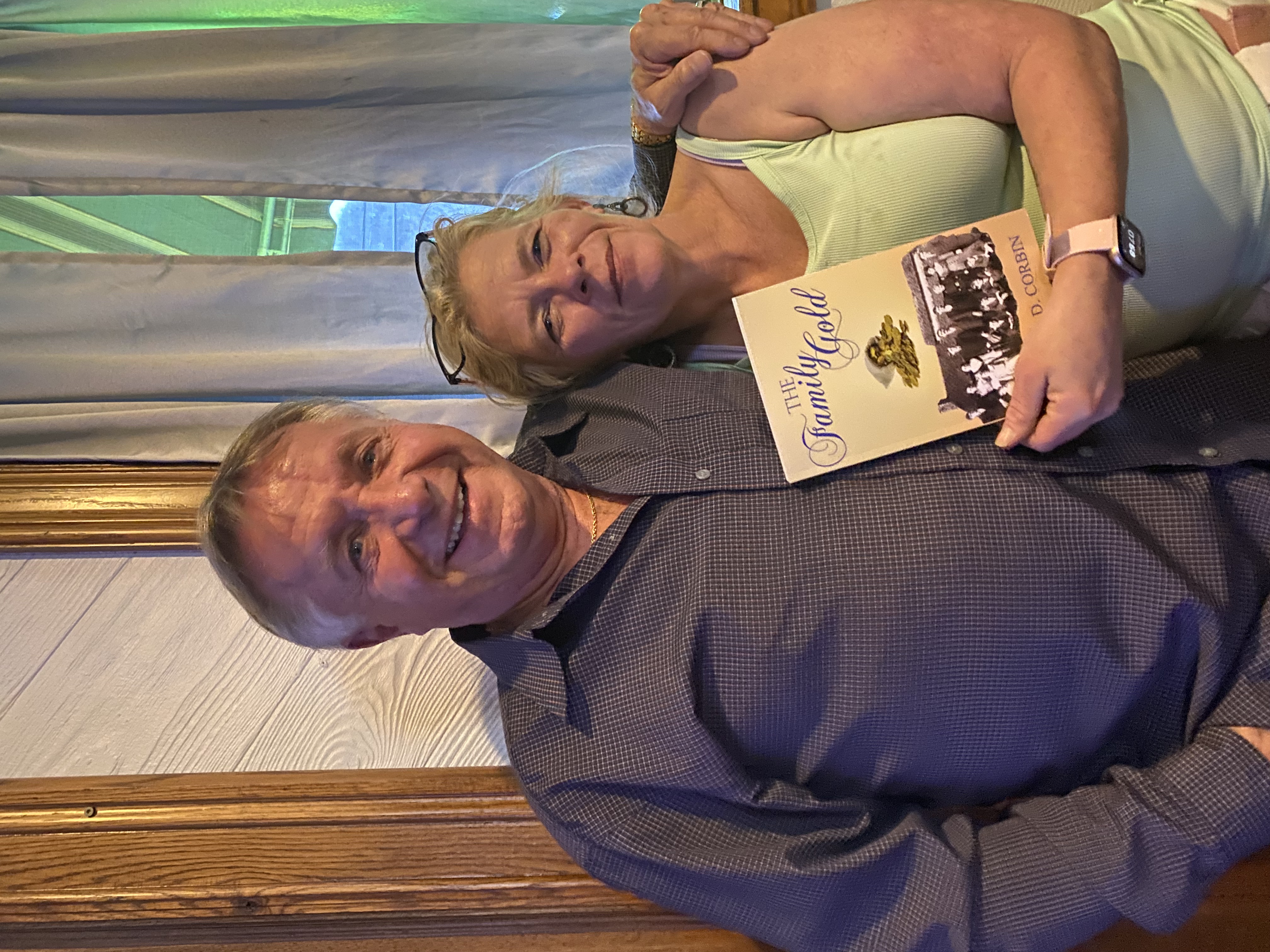 Reader with a signed copy of The Family Gold