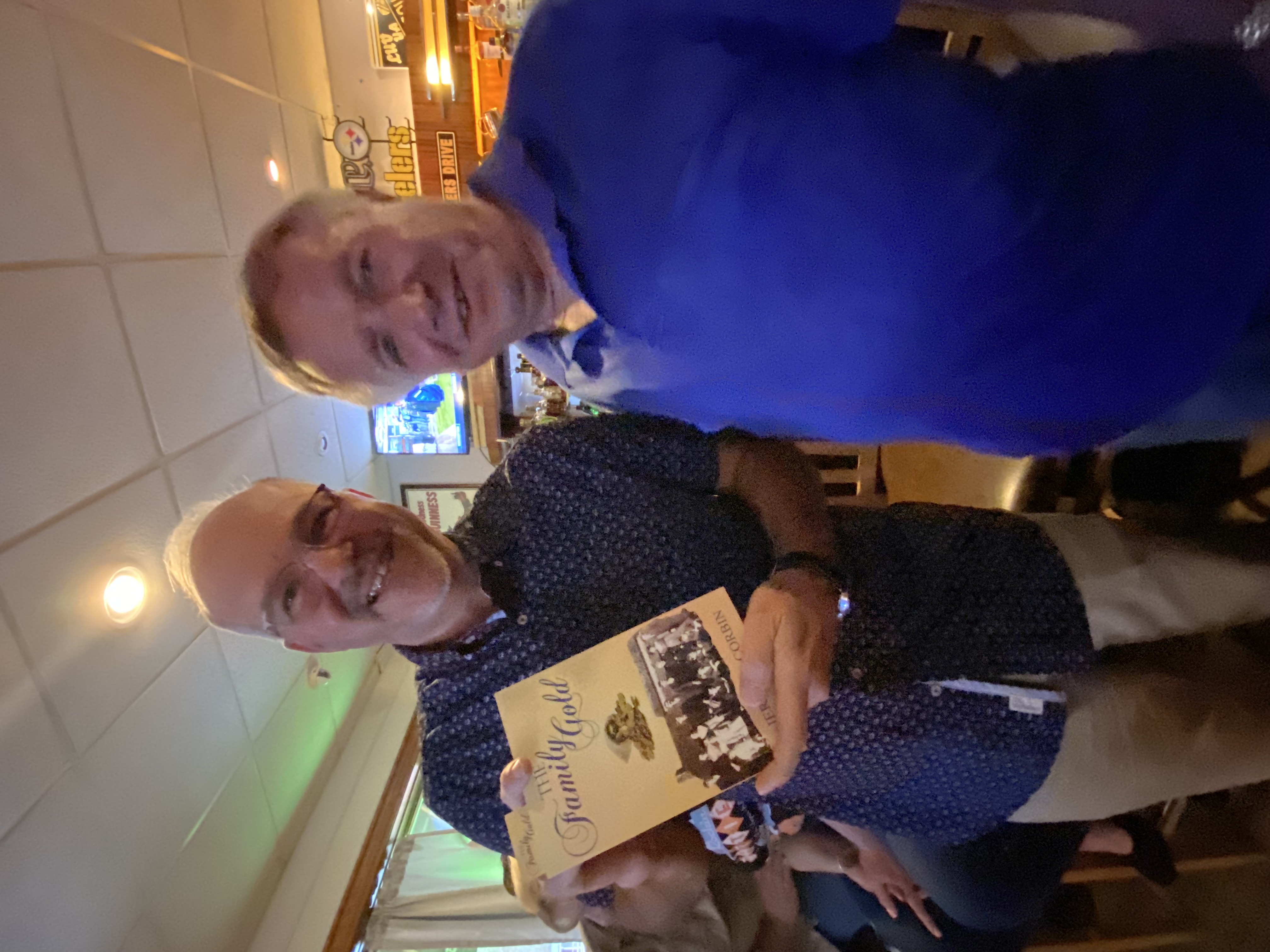 Readers holding The Family Gold