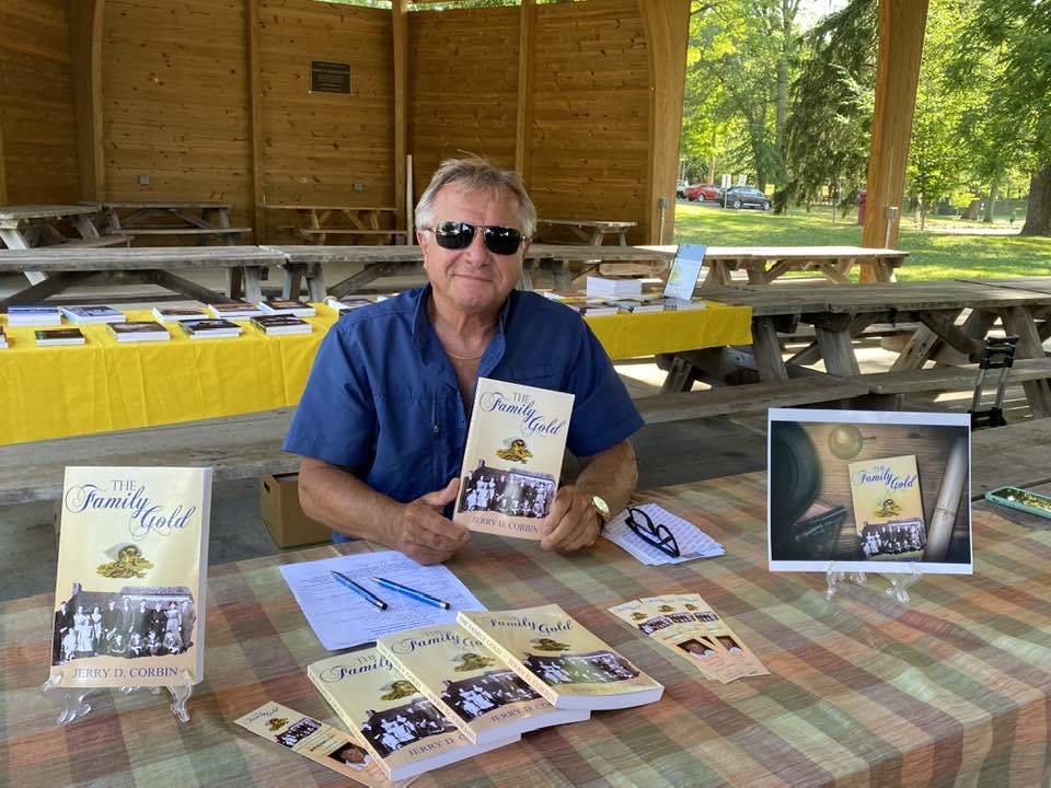 Signing copies of The Family Gold