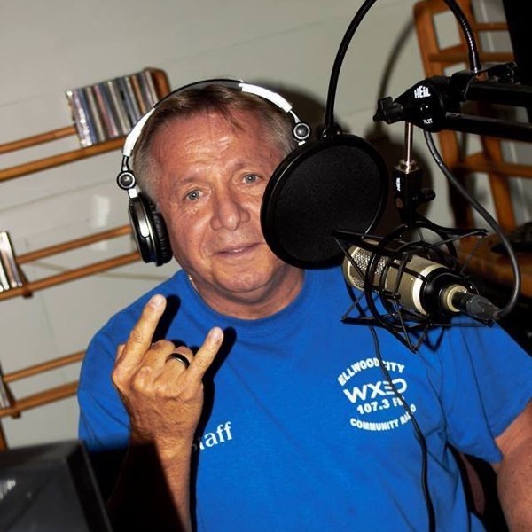 Jerry Corbin at the WXED 107.3 FM microphone hosting Building Memories